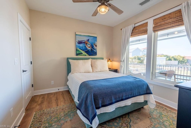 bedroom featuring hardwood / wood-style flooring and ceiling fan