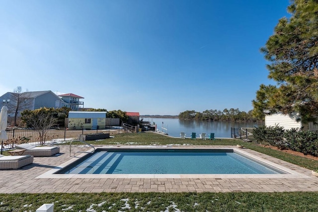 view of pool featuring a patio and a water view