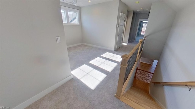 carpeted spare room with a wealth of natural light