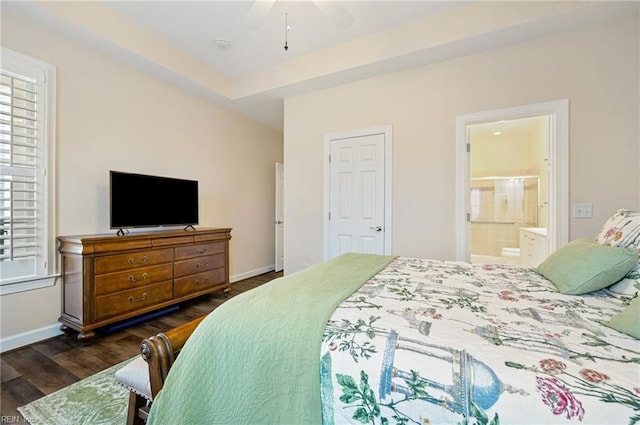 bedroom with dark hardwood / wood-style floors, connected bathroom, and ceiling fan