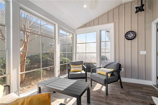 sunroom / solarium featuring vaulted ceiling