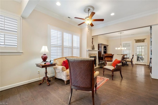 living room featuring dark hardwood / wood-style flooring, crown molding, and a healthy amount of sunlight