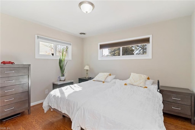 bedroom with hardwood / wood-style flooring