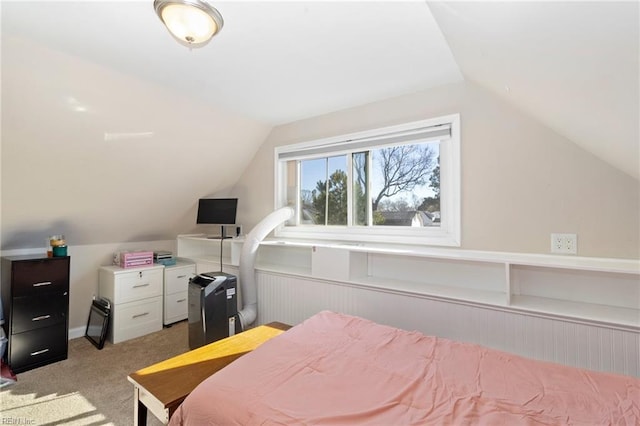 bedroom with light carpet and vaulted ceiling