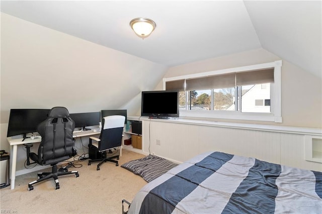 bedroom featuring vaulted ceiling and light carpet