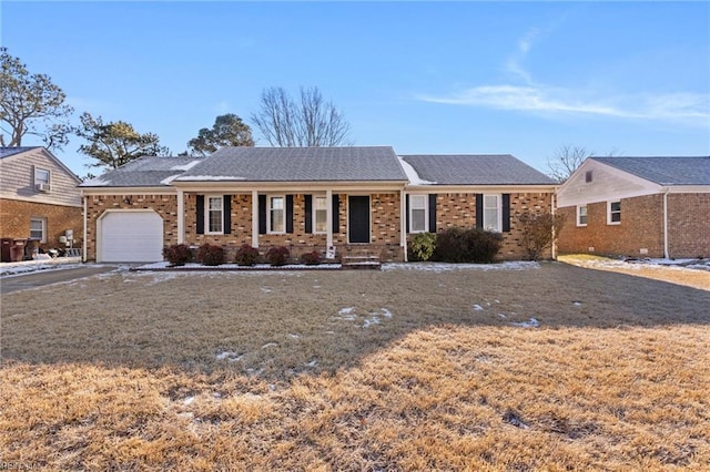 single story home with a porch and a garage