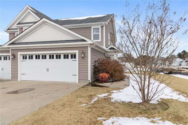 view of snow covered exterior featuring a garage