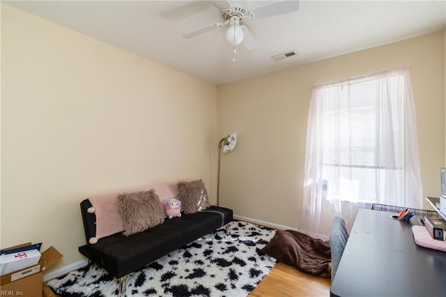 bedroom featuring hardwood / wood-style floors and ceiling fan