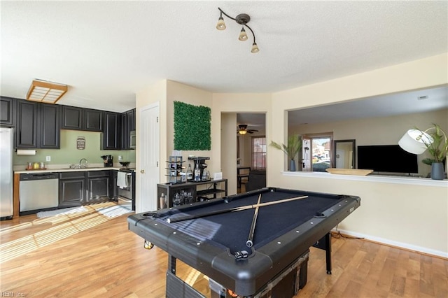 recreation room with sink, pool table, light hardwood / wood-style flooring, and ceiling fan