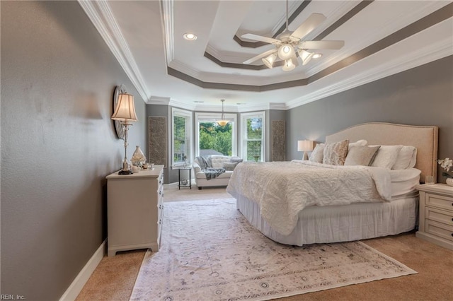 bedroom featuring crown molding, ceiling fan, a raised ceiling, and light colored carpet