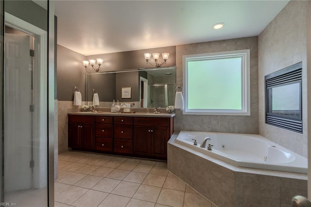 bathroom with vanity, tile patterned flooring, shower with separate bathtub, and a chandelier