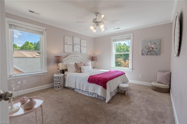 bedroom featuring crown molding, light carpet, and ceiling fan