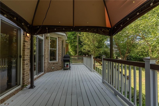 wooden deck featuring a gazebo