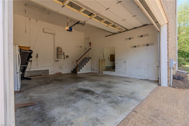 garage with white refrigerator and a garage door opener