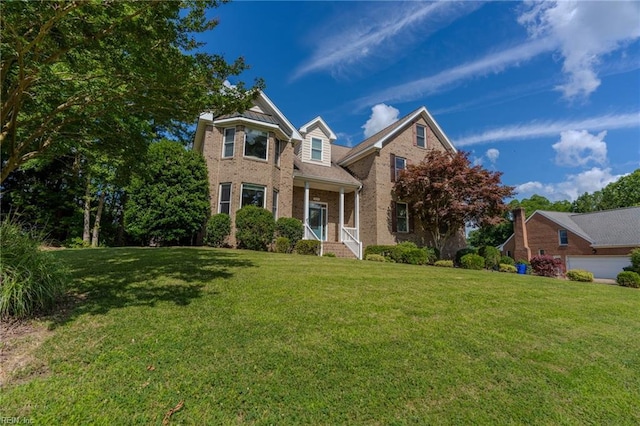 view of front of property with a porch and a front yard