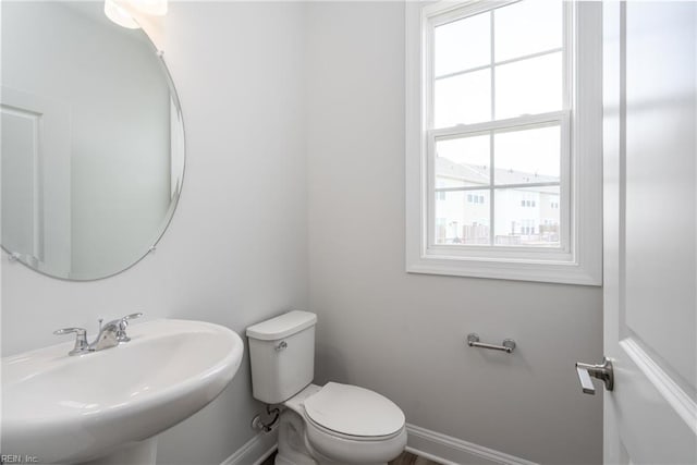 bathroom featuring sink and toilet