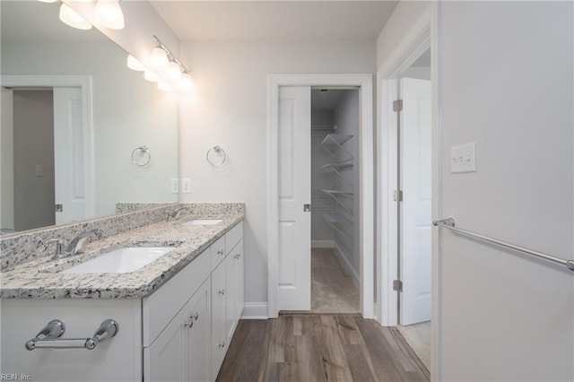 bathroom featuring vanity and hardwood / wood-style flooring