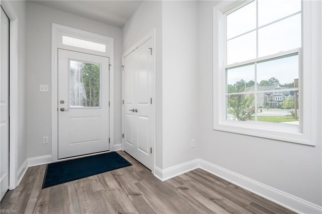 entryway with light hardwood / wood-style floors