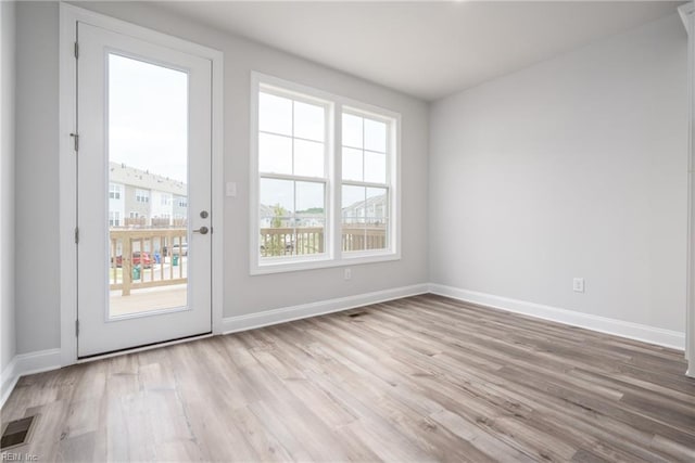 entryway featuring a healthy amount of sunlight and light wood-type flooring