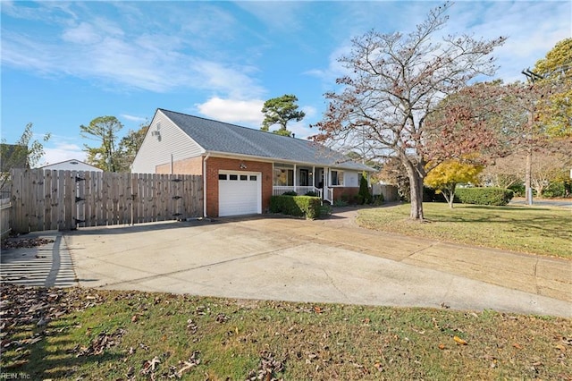 view of front of property with a garage and a front yard