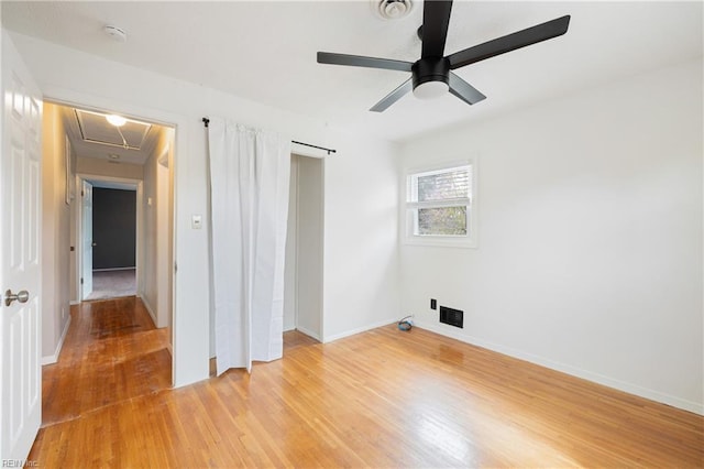 unfurnished room with ceiling fan and light hardwood / wood-style flooring