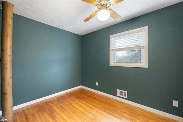 unfurnished room with hardwood / wood-style flooring and ceiling fan