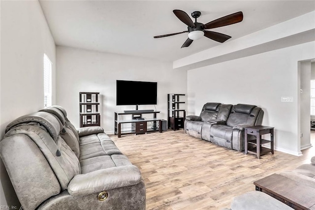 living room with ceiling fan and light hardwood / wood-style floors