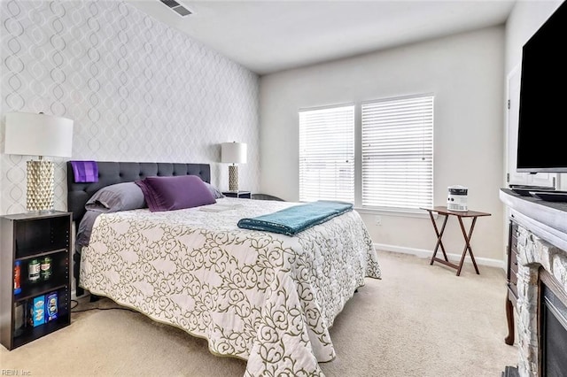 bedroom featuring light colored carpet