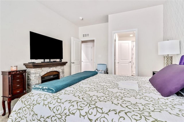 bedroom featuring a fireplace