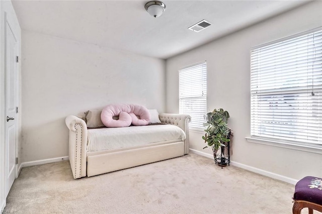 sitting room with light colored carpet