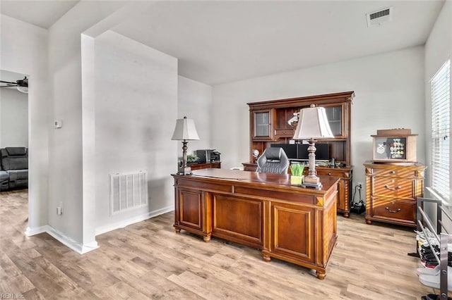 home office featuring ceiling fan and light wood-type flooring