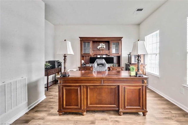 office area with light hardwood / wood-style flooring