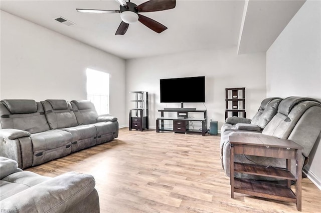 living room with ceiling fan and light wood-type flooring