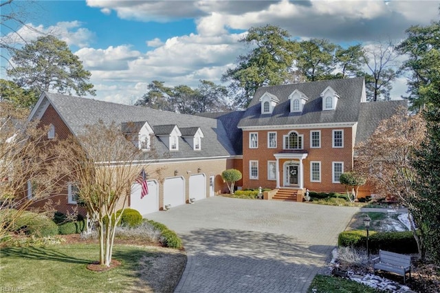 view of front of home featuring a garage and a front yard