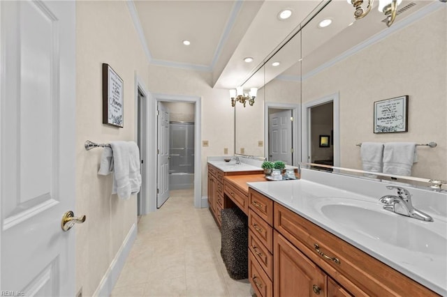 bathroom featuring vanity, crown molding, a shower with shower door, and tile patterned floors