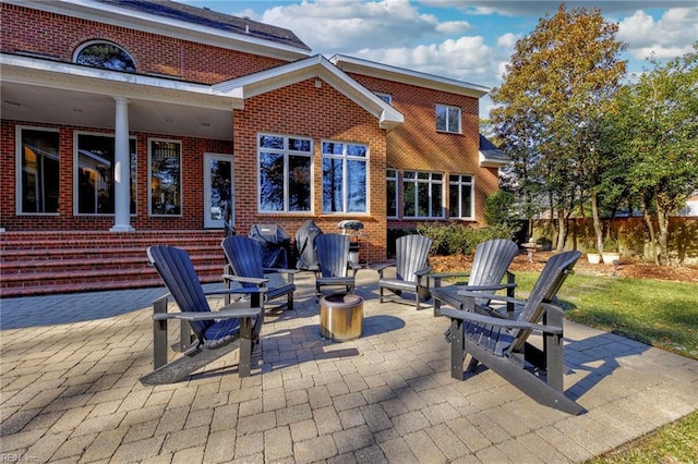 view of patio / terrace featuring an outdoor fire pit