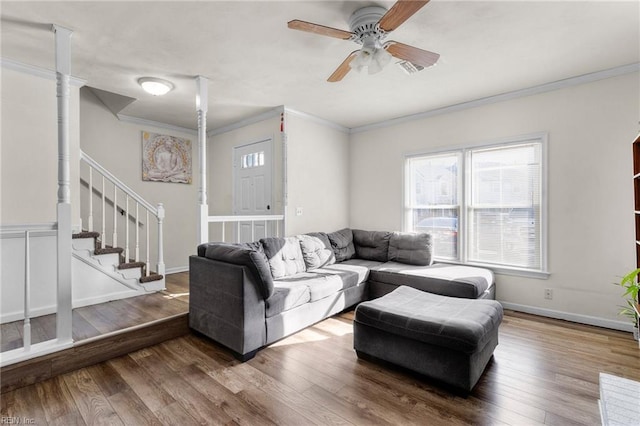 living room featuring crown molding, ceiling fan, and hardwood / wood-style floors