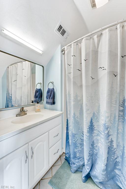 bathroom with vanity and tile patterned floors