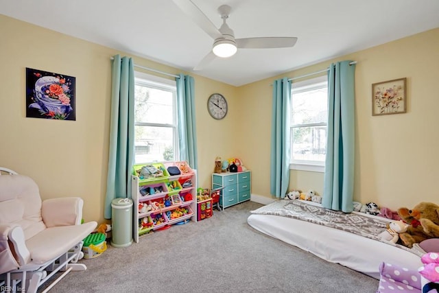 bedroom with multiple windows, carpet floors, and ceiling fan