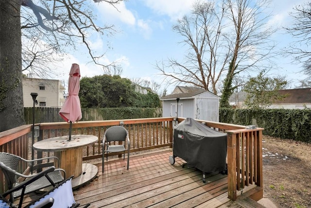 wooden deck with grilling area and a shed