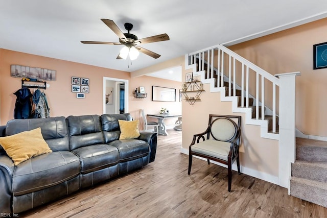 living room with hardwood / wood-style flooring and ceiling fan