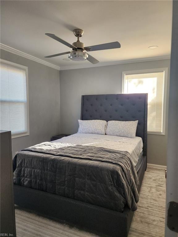 bedroom featuring ornamental molding and ceiling fan