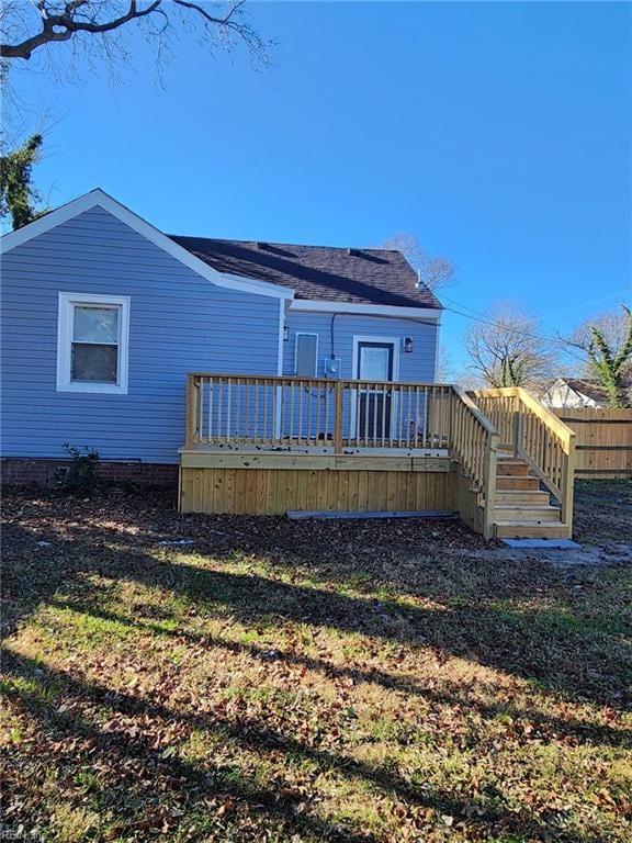 rear view of house with a wooden deck