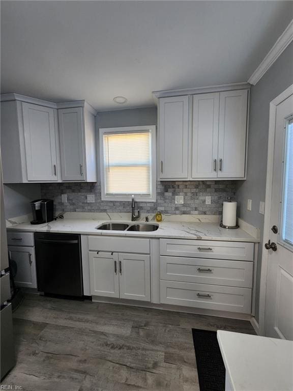 kitchen with sink, ornamental molding, dark hardwood / wood-style floors, black dishwasher, and white cabinets