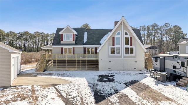 snow covered house with covered porch