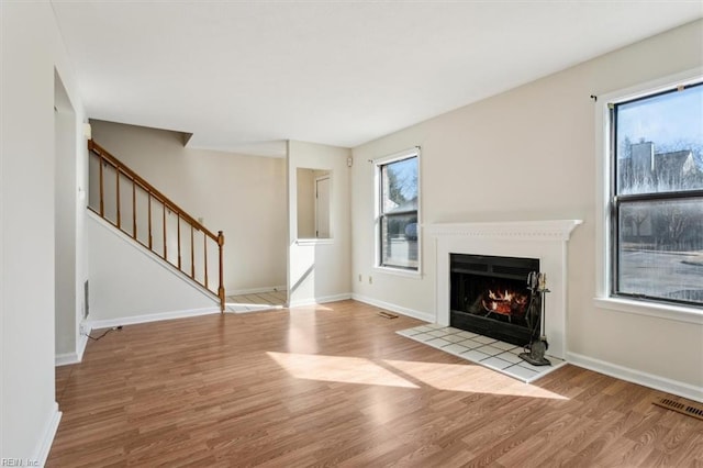 unfurnished living room featuring light hardwood / wood-style floors