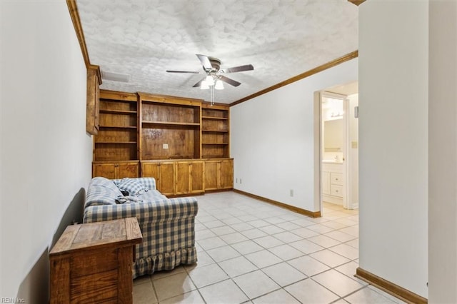 living area with ceiling fan, ornamental molding, a textured ceiling, and light tile patterned flooring