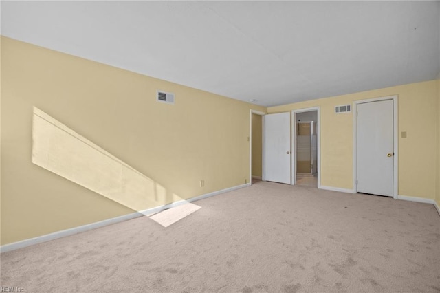 unfurnished room featuring carpet flooring