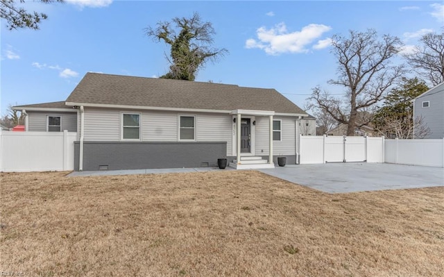 view of front of house with a patio and a front lawn