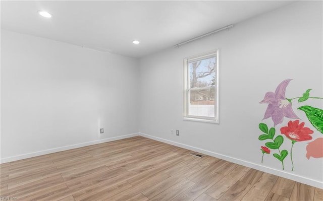 spare room with light wood-type flooring